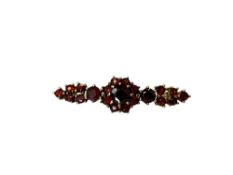 A gold garnet brooch