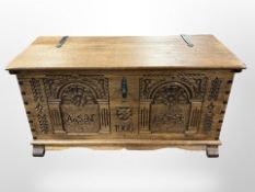 A Scandinavian heavily carved blanket chest dated 1966,