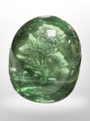 A Victorian Sunderland green glass dump with thistle inclusion, height 8.5cm.