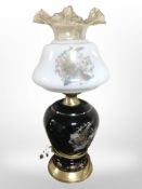 A table lamp in the form of an oil lamp,