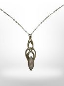 An Art Nouveau yellow metal and mother of pearl pendant, marked indistinctly, on 9ct gold necklace,