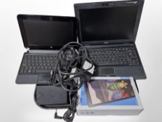 A Lenovo tablet, and two notebooks, with leads.