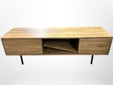 A Scandinavian teak effect sliding door low entertainment sideboard,