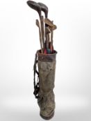 A vintage golf bag and clubs (as found)