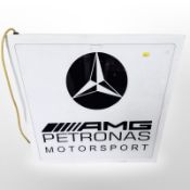 An illuminated Mercedes AMG sign,