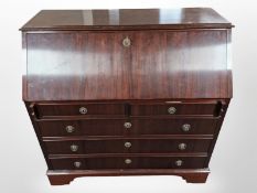 A reproduction mahogany writing bureau,