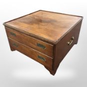 A mahogany campaign style square coffee table fitted two drawers, with brass drop handles to sides,