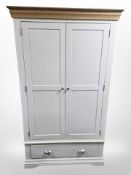 A contemporary oak and MDF double door wardrobe,