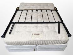 A king size divan with Dunlopillo mattress and reproduction metal headboard