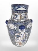 An Oriental earthen ware baluster vase,