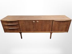An AH McIntosh teak low sideboard,