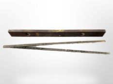 A Wilson Lovatt & Sons 'Tema' spirit level, length 91cm, and a further folding rule.