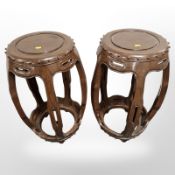 A pair of reproduction Chinese style hardwood barrel shaped plant stands,