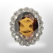 An 18ct white gold garnet dress ring, size P.