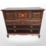 A late Victorian mahogany and satinwood inlaid chest fitted cupboards and drawers,