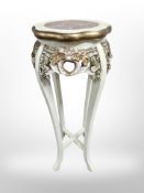 A Chinese carved hardwood and marble inset jardiniere stand, later painted and gilded,