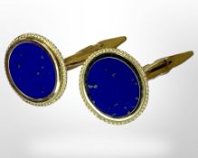 A pair of lapis lazuli cufflinks set in 14ct yellow gold.
