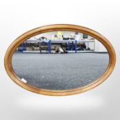 An oak oval mirror,
