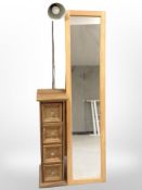 A contemporary cheval easel mirror, length 150cm, together with a slim pine four-drawer chest,