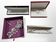 A group of costume pendants and earrings.