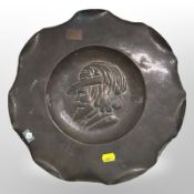A copper charger depicting Shakespeare, diameter 34cm.