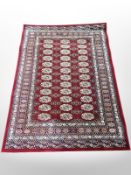 A machine made rug of Afghan design,