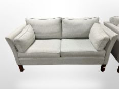 A late 20th century Danish two-seater settee in pale blue fabric,