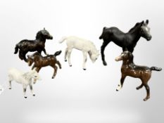A group of six small Beswick foal figures in various colourways.