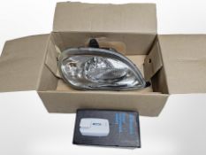 A boxed Citroen car head light and a soap dispenser