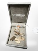 A pair of 9ct gold cuff links and a continental gold ring set with pearls,