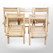 A set of five folding chairs