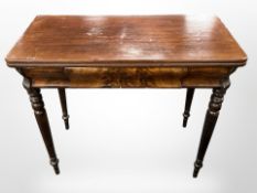 A 19th century mahogany turnover top tea table, fitted a drawer,