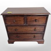 A reproduction mahogany three-drawer apprentice chest, width 28cm.