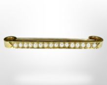 A 15ct gold pearl set bar brooch, width 4.5 cm.