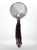 A magnifying glass with antler handle and silver mounts, length 25cm.