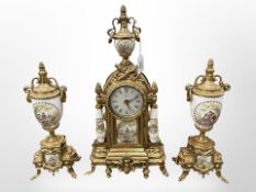 An ornate reproduction gilt-brass three-piece clock garniture set with battery movement,