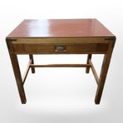 A Danish teak single drawer side table with brass corner mounts,