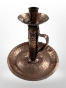 A hammered copper on pewter chamber stick, height 18cm.