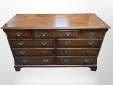 A Burton's Reproductions Limited mahogany nine drawer chest,