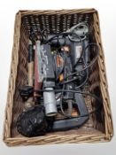 Several Challenge power tools in wicker basket