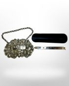 A silver toothpick together with a Georgian silver port label.