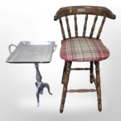 A contemporary high stool and a chrome tripod table