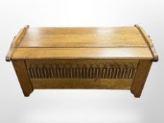 A reproduction oak blanket box,