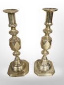 A pair of Victorian diamond-pattern brass candlesticks, height 29cm.