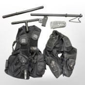 A group of police truncheons, breathalyzer,