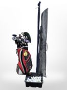 A golf bag, assorted irons and drivers including Adams, Wilson etc,