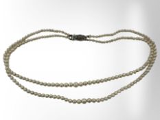 A double strand cultured pearl necklace with silver clasp