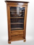A 19th century continental walnut single door bookcase,