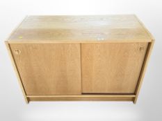 A 20th century Danish oak veneered low sideboard,