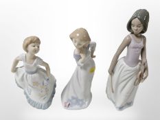 Three Nao figures of girls, tallest 27cm.